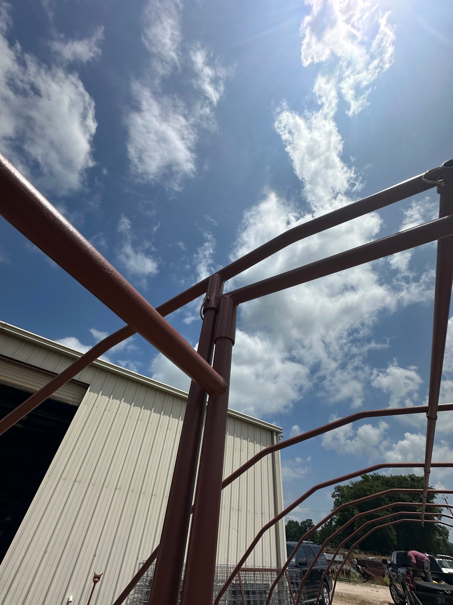 Metal structure against a blue sky with clouds